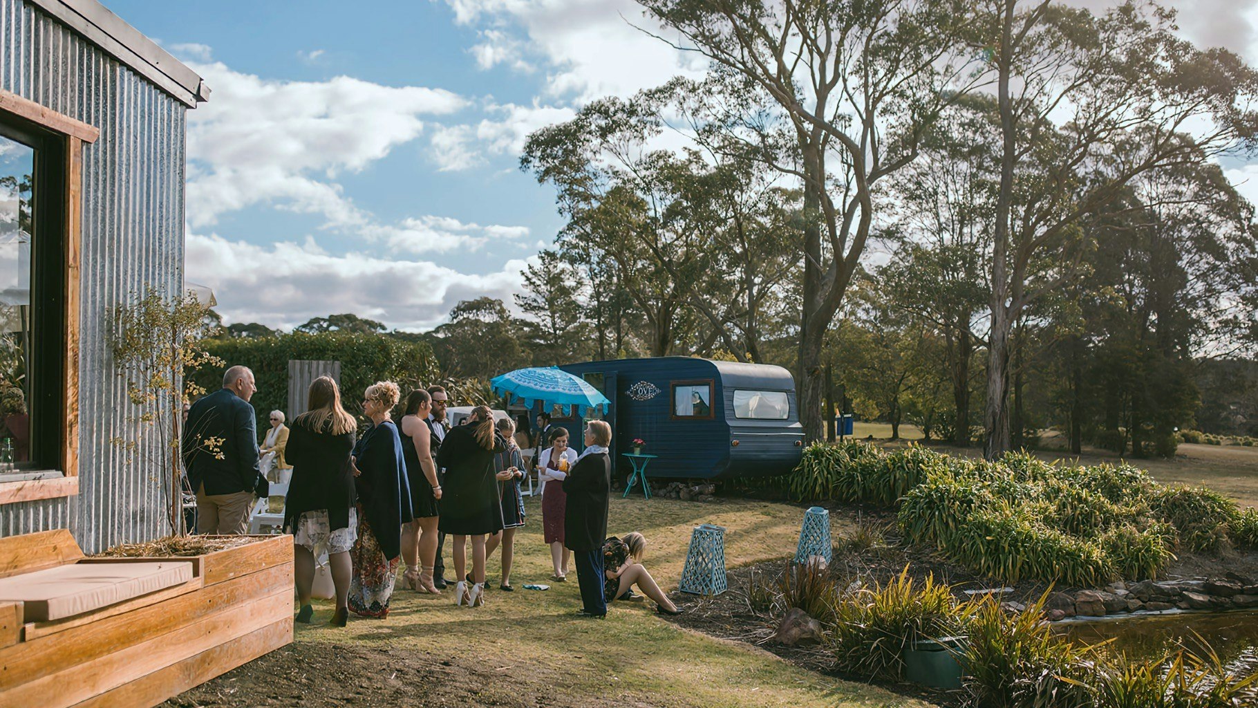 Wedding guests gather outside Sylvan Glen.